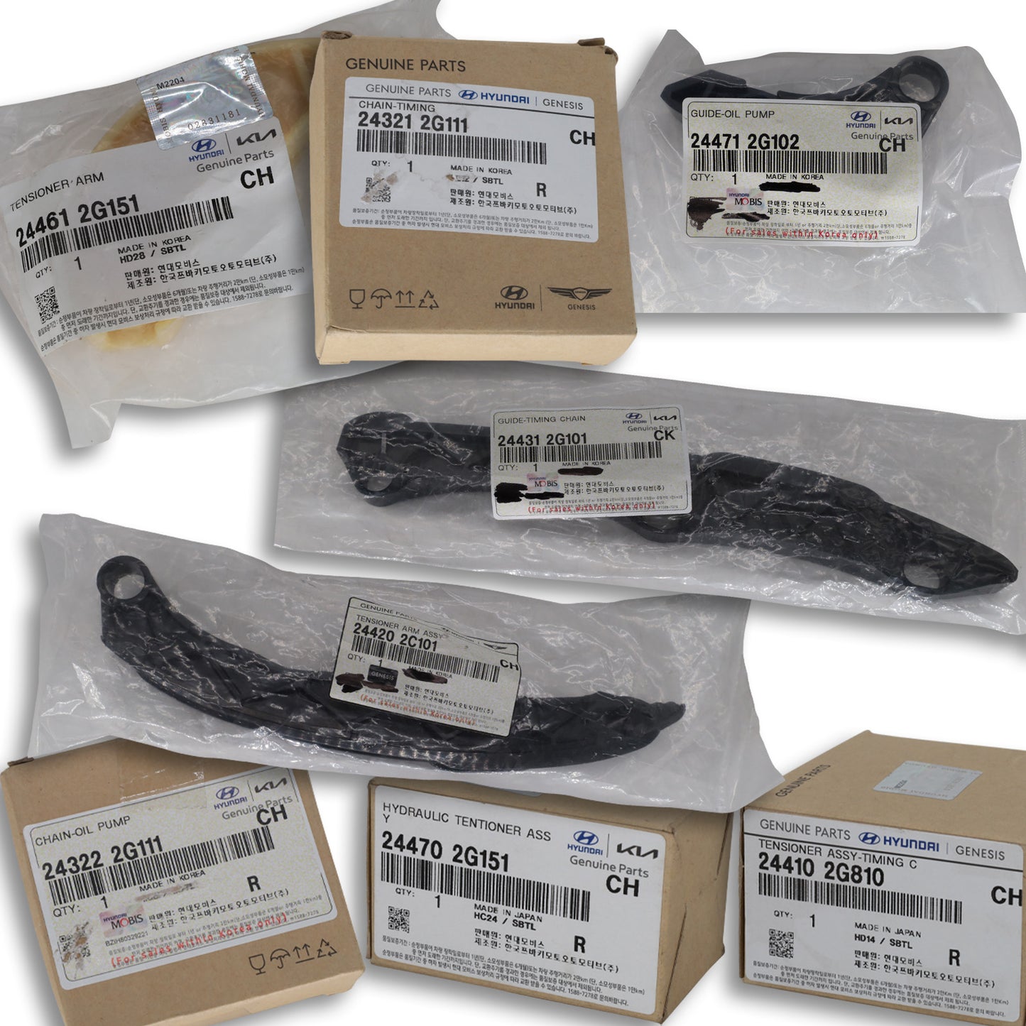 Collection of packaged automotive parts with visible brand labels on a white background